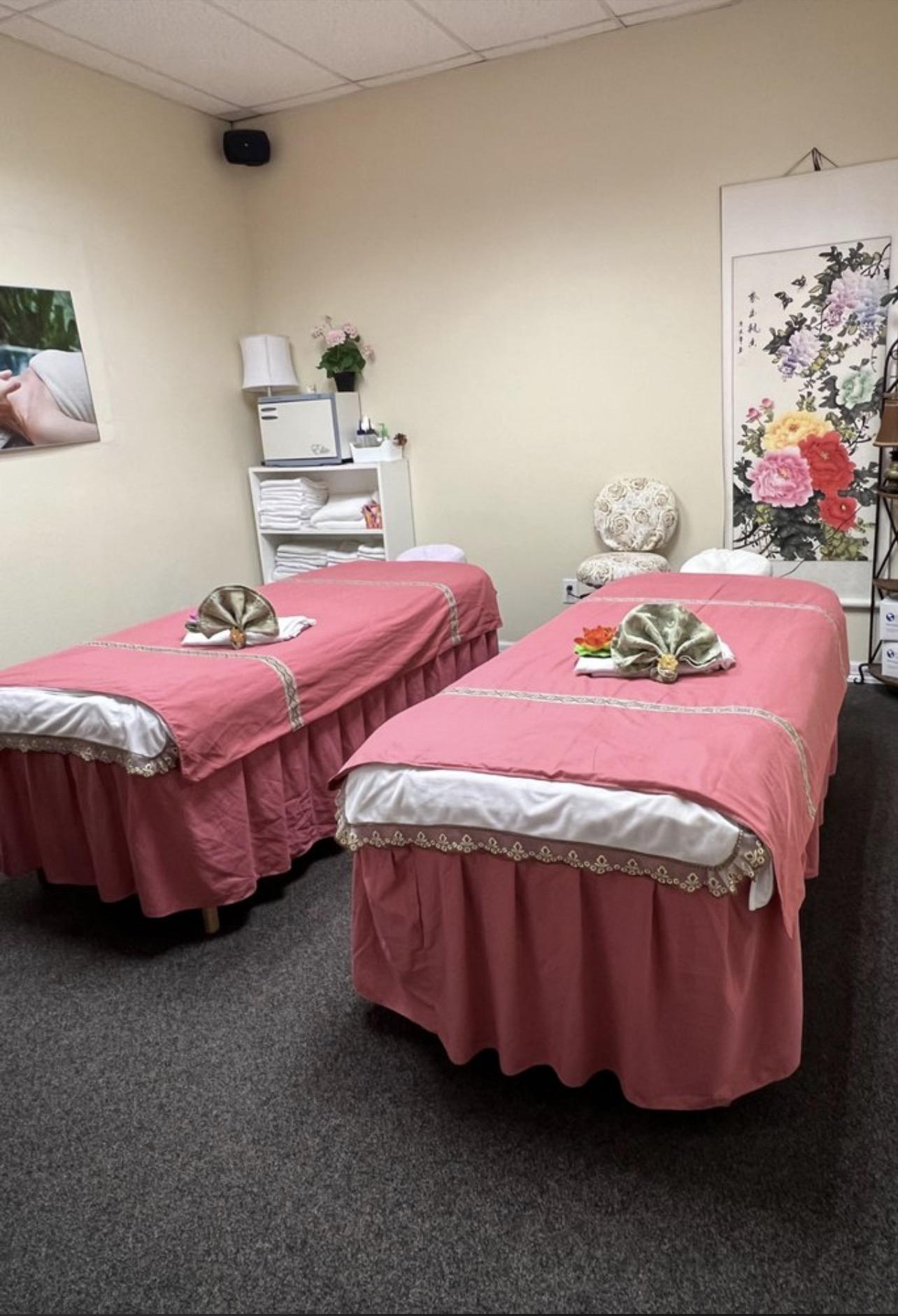 Couples massage room with two beds